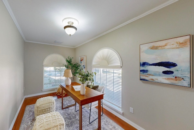 home office featuring wood-type flooring and ornamental molding