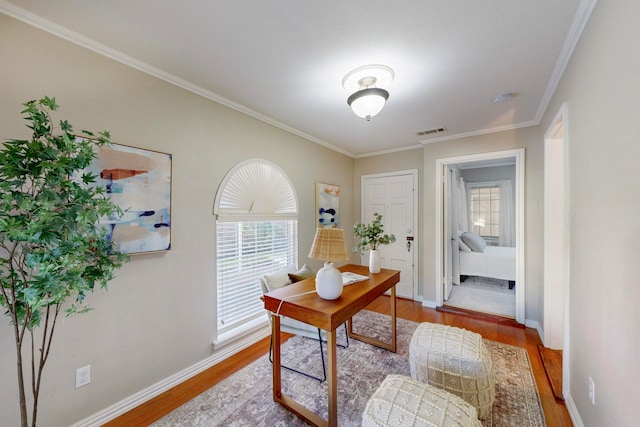 office space with hardwood / wood-style flooring and ornamental molding