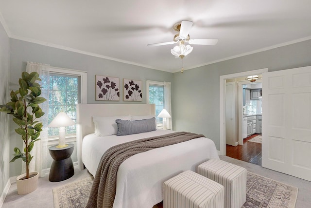 bedroom featuring ceiling fan and ornamental molding