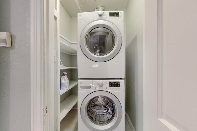 laundry room featuring stacked washer and dryer