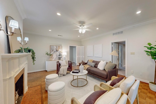 living room with radiator, ceiling fan, light parquet floors, and ornamental molding