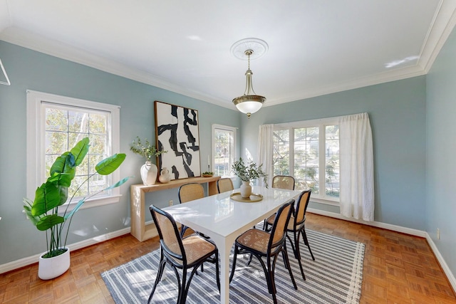 dining area featuring ornamental molding and parquet flooring