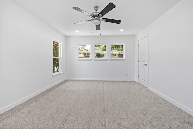 unfurnished room with carpet and ceiling fan