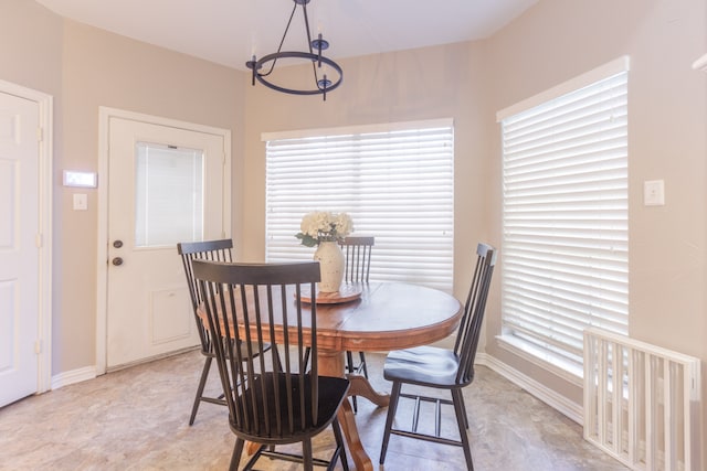 dining room featuring a chandelier