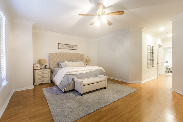 bedroom with ceiling fan, hardwood / wood-style floors, and ornamental molding