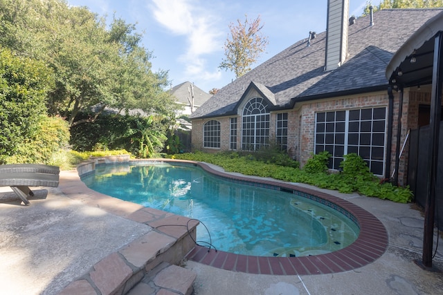 view of swimming pool featuring a patio area