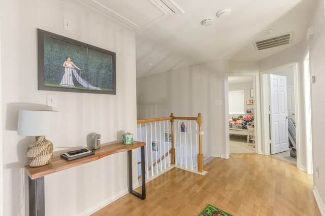 hallway with light hardwood / wood-style flooring