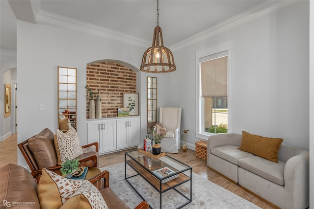 living room featuring light hardwood / wood-style flooring and ornamental molding