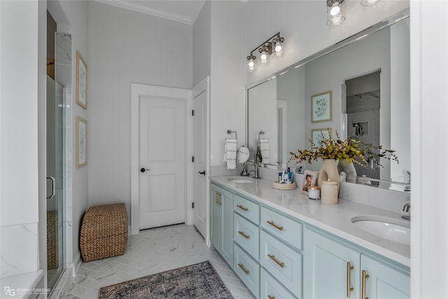 bathroom with vanity, an enclosed shower, and crown molding