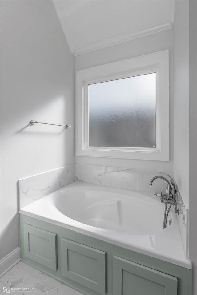 bathroom featuring a tub, crown molding, and vaulted ceiling