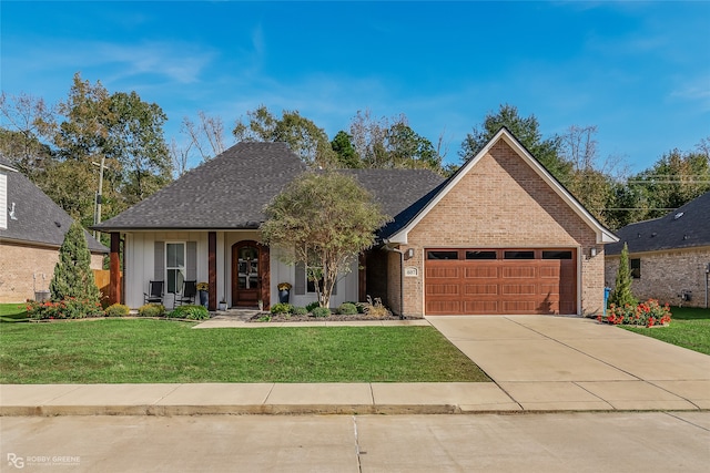 view of front of house with a front lawn, a porch, and a garage