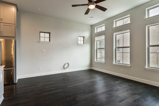 unfurnished room with dark hardwood / wood-style floors and ceiling fan