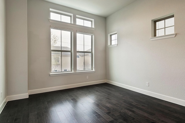 empty room featuring dark hardwood / wood-style floors