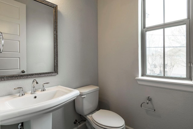 bathroom featuring toilet and sink