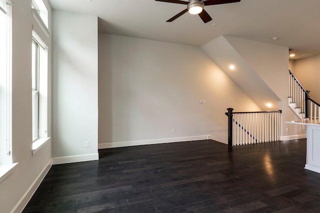 spare room featuring dark hardwood / wood-style floors and ceiling fan