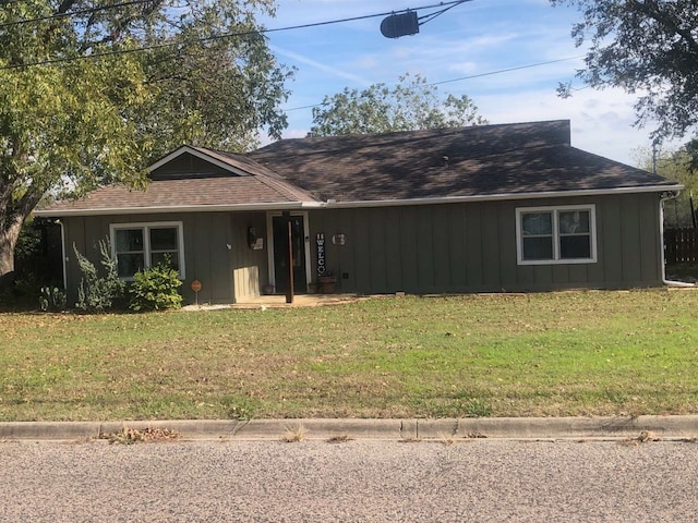 ranch-style house with a front lawn