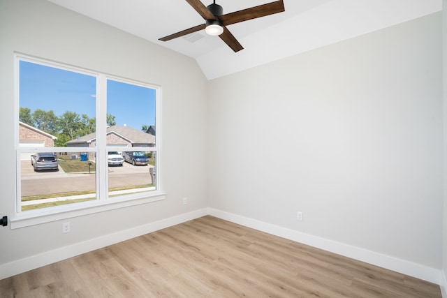 empty room with light hardwood / wood-style flooring, ceiling fan, and lofted ceiling