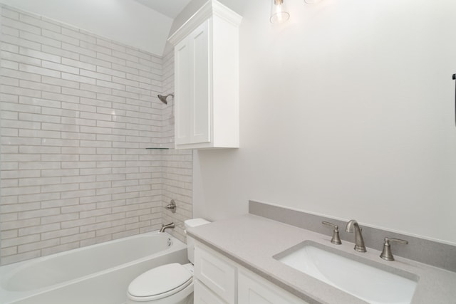 full bathroom featuring vanity, toilet, and tiled shower / bath combo