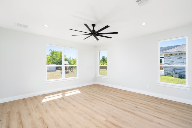 spare room with ceiling fan and light hardwood / wood-style flooring