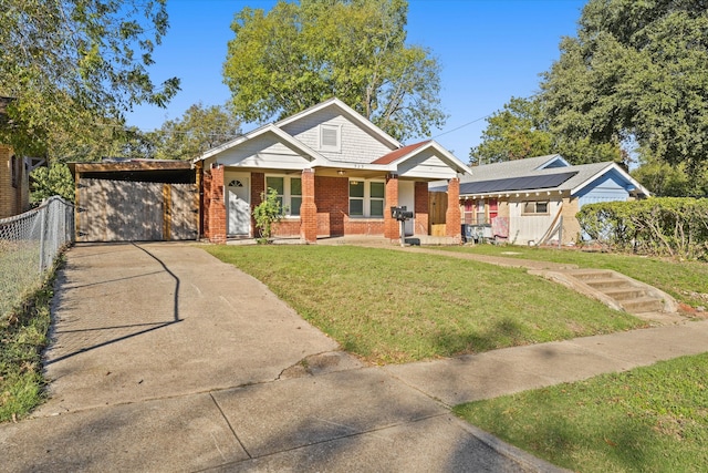 view of front facade featuring a front lawn, a porch, and a carport