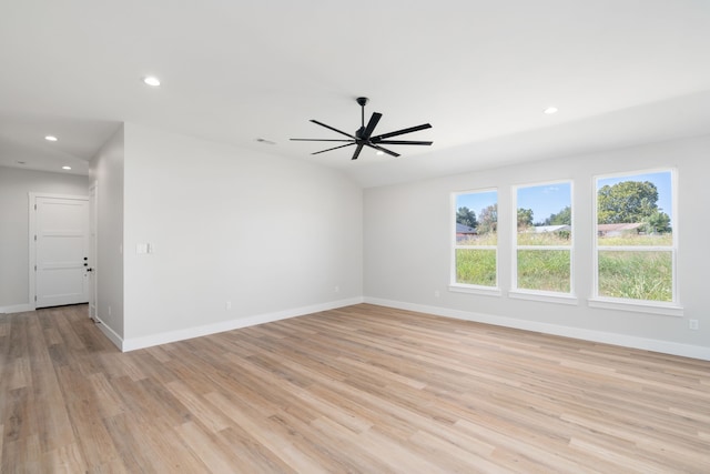 spare room featuring ceiling fan and light hardwood / wood-style flooring