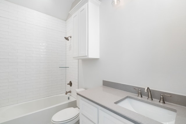 full bathroom with toilet, vanity, and tiled shower / bath combo