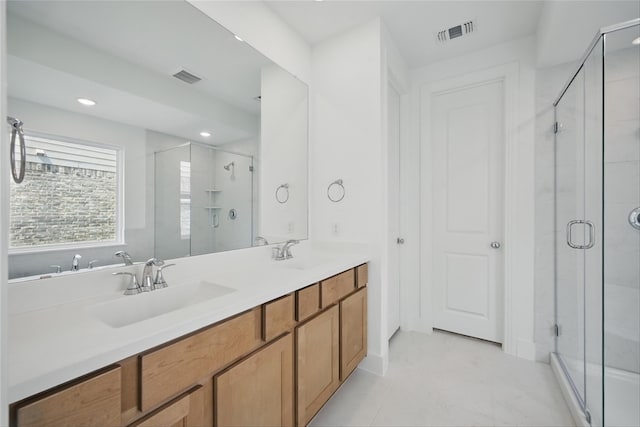 4182 Carter Ct, Denison, TX 75020 - bathroom with a shower stall, double vanity, and recessed lighting