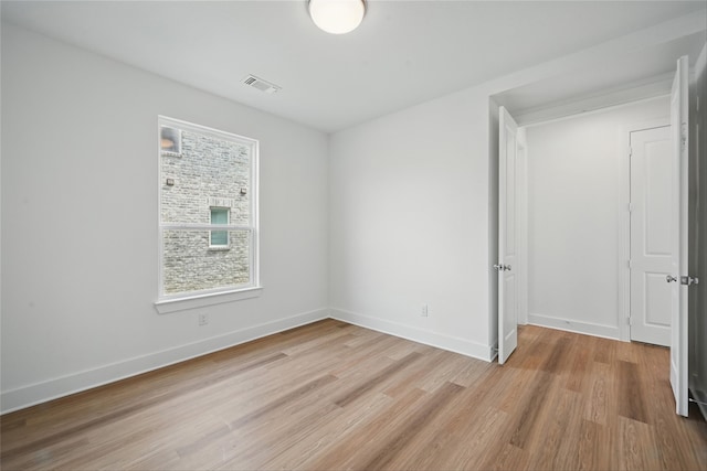 4182 Carter Ct, Denison, TX 75020 - unfurnished bedroom with light wood finished floors and baseboards