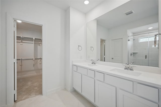 4182 Carter Ct, Denison, TX 75020 - full bath featuring a shower stall, a spacious closet, double vanity, recessed lighting, and baseboards