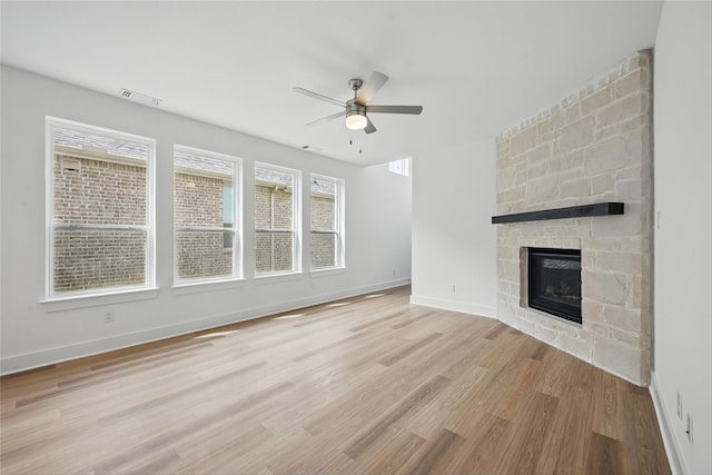 4182 Carter Ct, Denison, TX 75020 - unfurnished living room with a ceiling fan, light wood finished floors, a fireplace, and baseboards