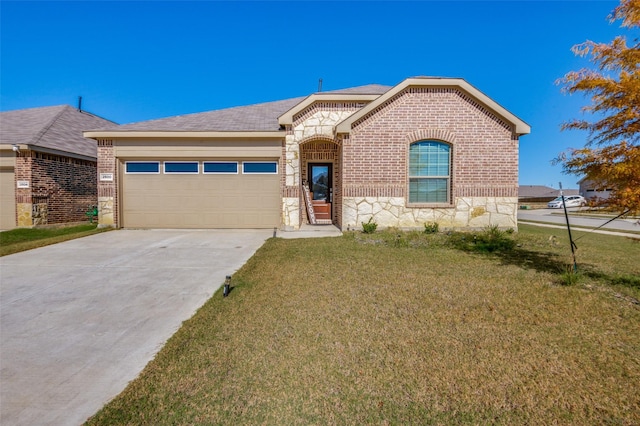 view of front of house featuring a front yard and a garage