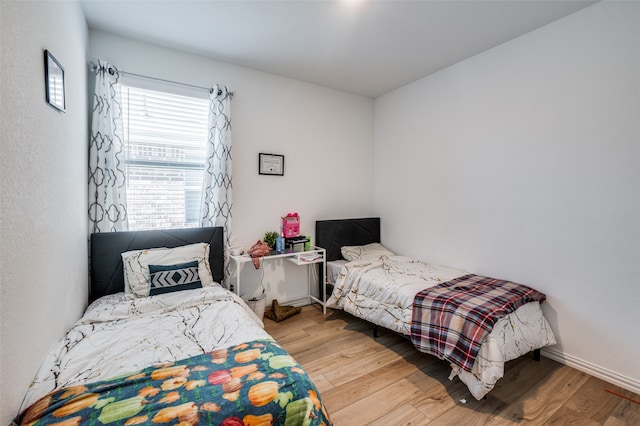 bedroom with light hardwood / wood-style flooring