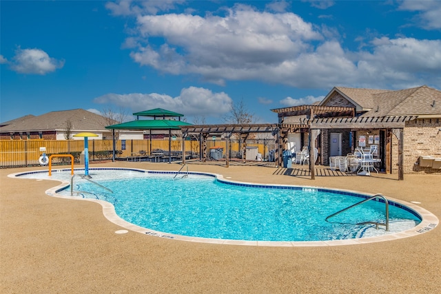 view of pool with a pergola and a patio