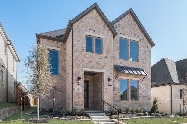 view of front of home with a front lawn