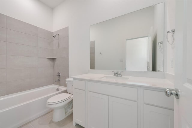 full bathroom featuring tiled shower / bath, vanity, toilet, and tile patterned floors