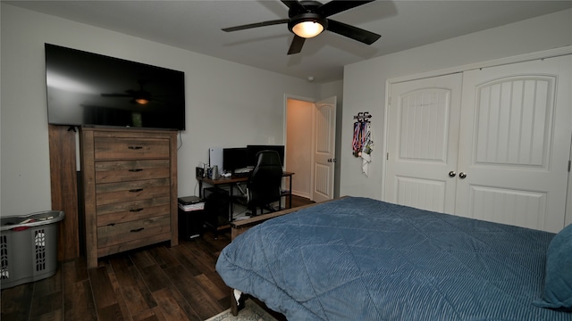 bedroom featuring ceiling fan, a closet, and dark wood-type flooring