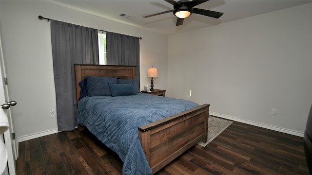 bedroom with ceiling fan and dark wood-type flooring