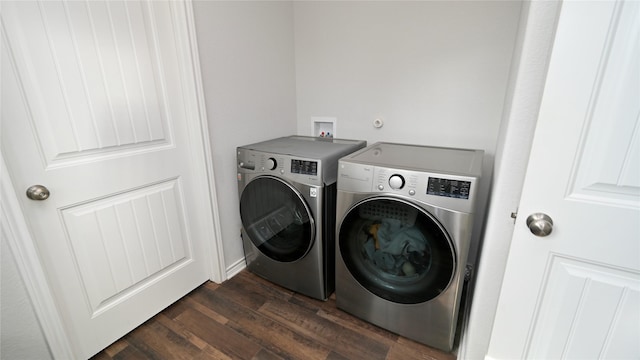 washroom featuring dark hardwood / wood-style floors and separate washer and dryer