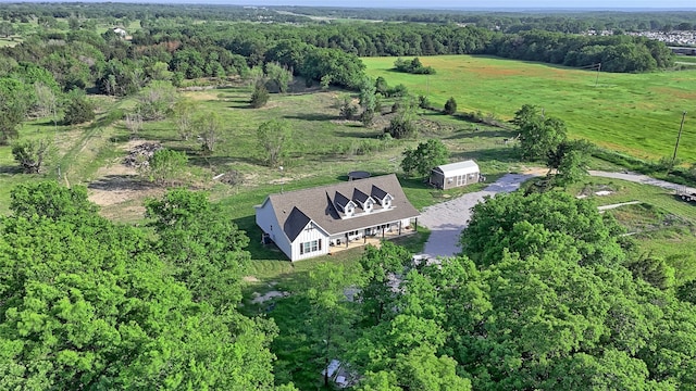 birds eye view of property featuring a rural view