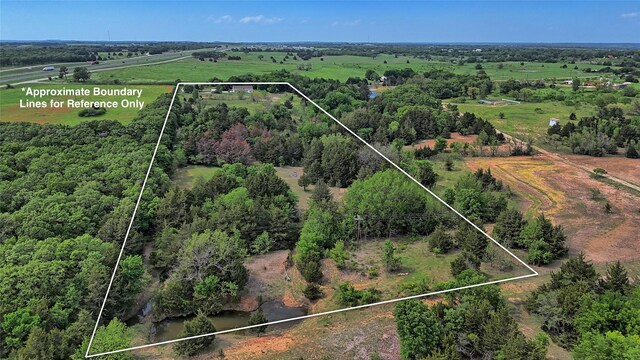 birds eye view of property featuring a rural view