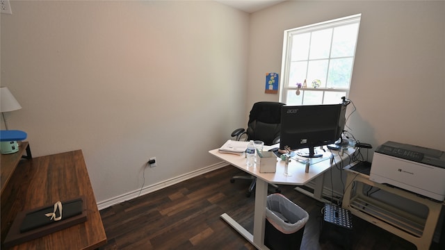 home office with dark hardwood / wood-style flooring