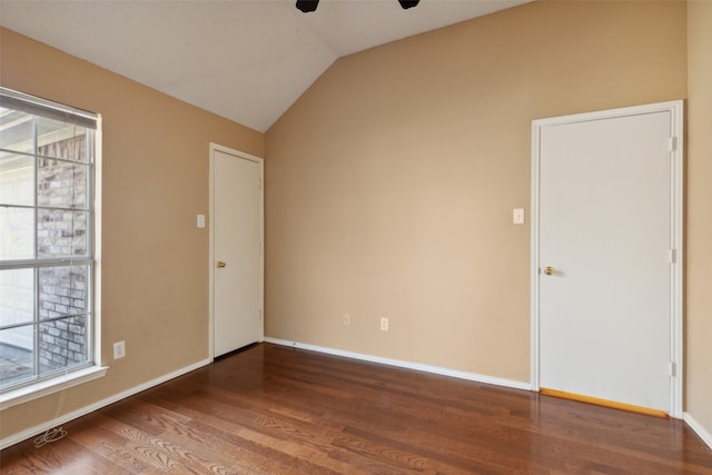 unfurnished room with hardwood / wood-style flooring, ceiling fan, and lofted ceiling