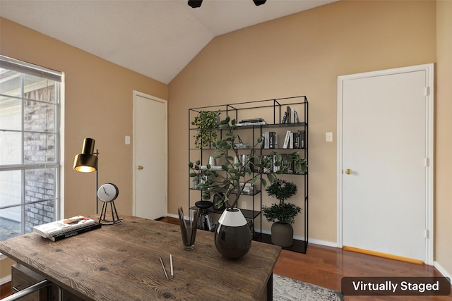 office with hardwood / wood-style floors and vaulted ceiling