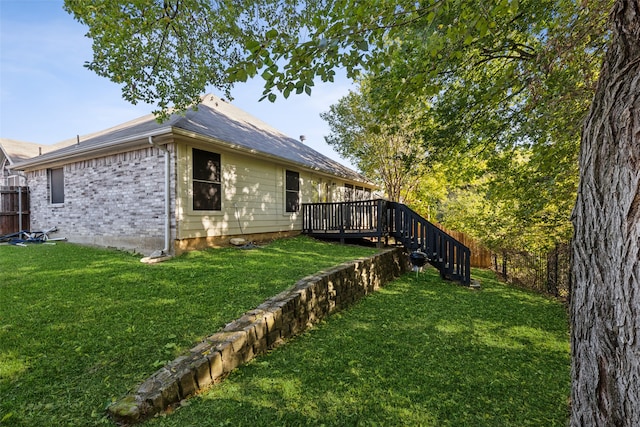 view of yard with a deck