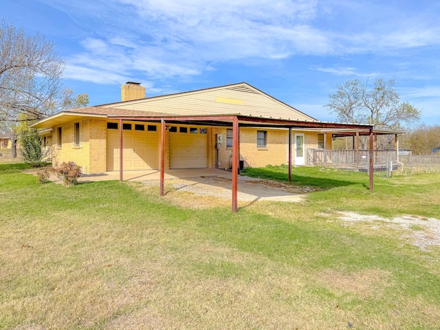 rear view of property featuring a lawn, a porch, and a garage