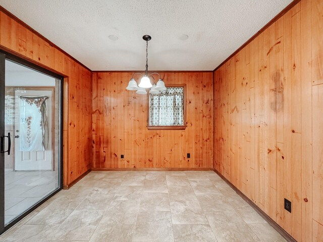 kitchen featuring a textured ceiling, backsplash, white appliances, and crown molding