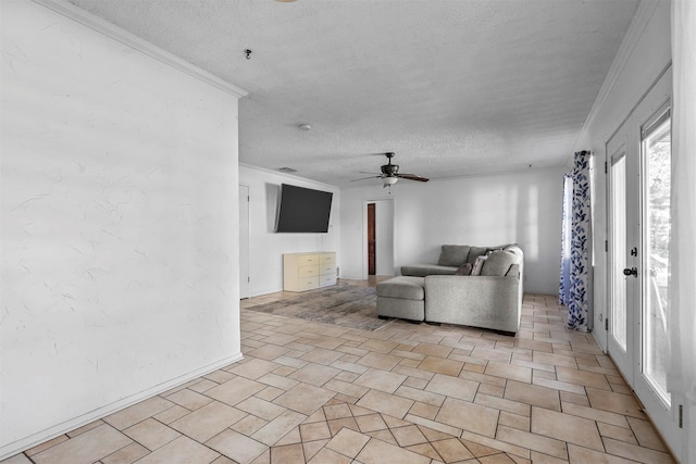 unfurnished living room featuring ceiling fan, a textured ceiling, and ornamental molding