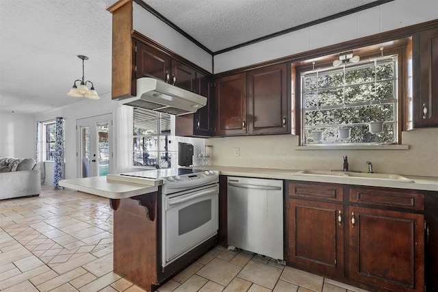 kitchen featuring sink, decorative light fixtures, stainless steel dishwasher, a textured ceiling, and white electric range oven