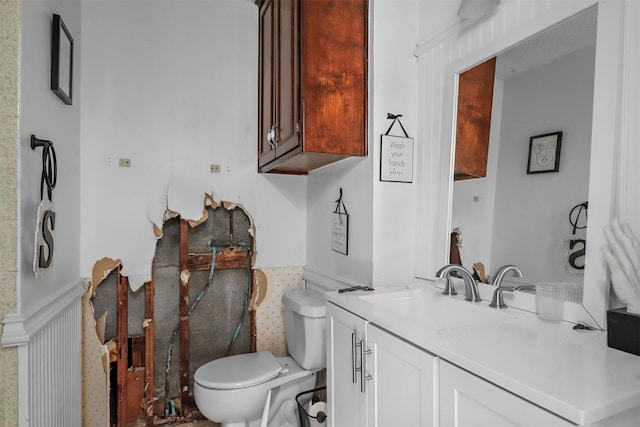 bathroom with vanity and toilet