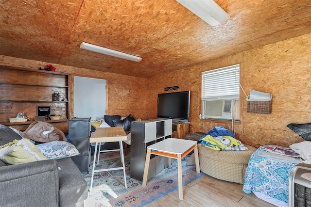 living room featuring light hardwood / wood-style floors and cooling unit